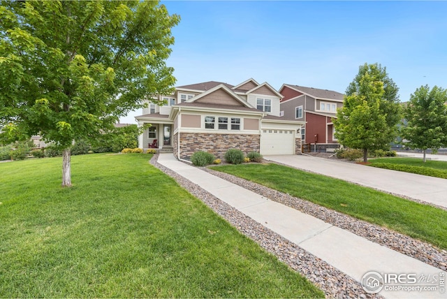 view of front of property featuring a garage and a front yard