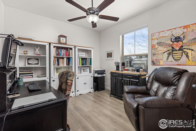 office featuring ceiling fan and light wood-type flooring