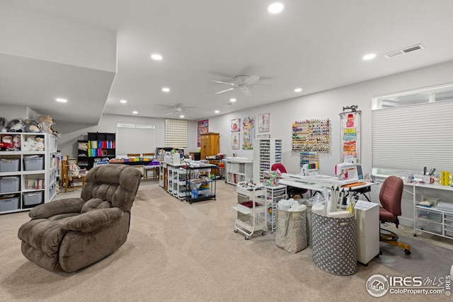 game room featuring light colored carpet and ceiling fan