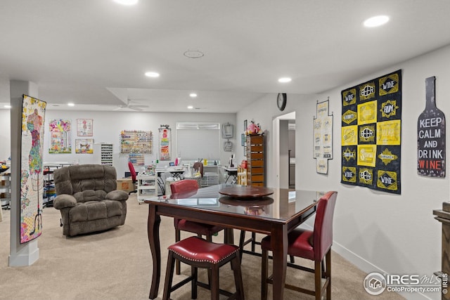 dining area featuring carpet floors and ceiling fan