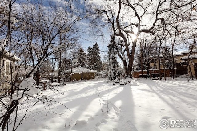 view of yard layered in snow