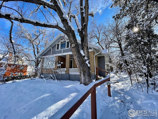 chalet / cabin featuring covered porch