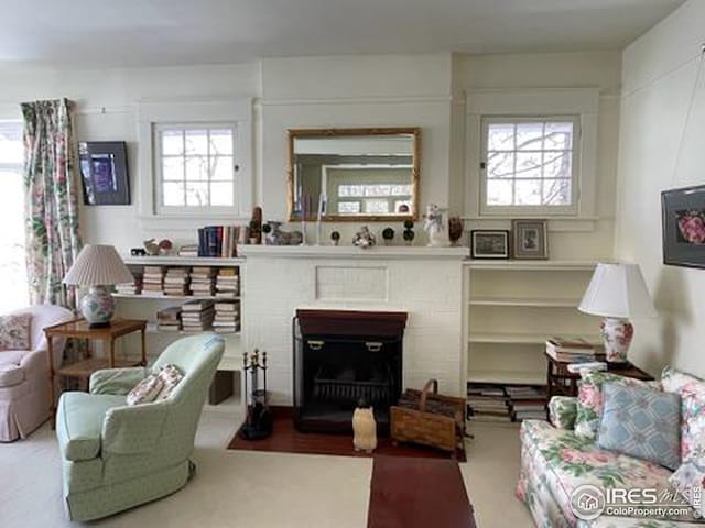 living room featuring a fireplace