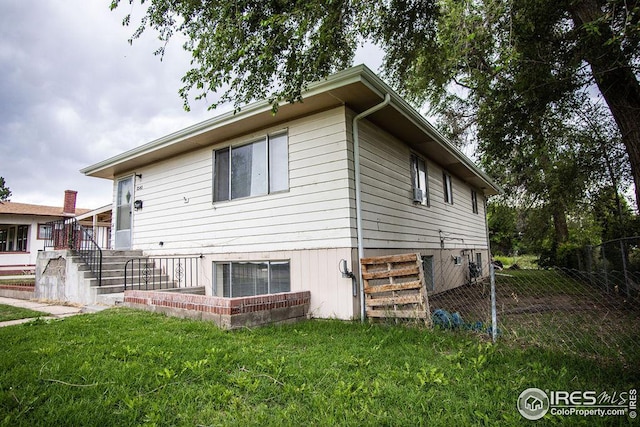 view of property exterior with a yard