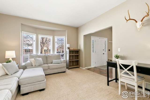 living room featuring light carpet