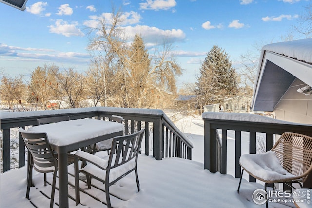 view of snow covered deck