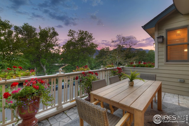 view of balcony at dusk