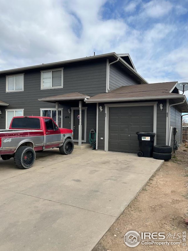 view of front of property featuring a garage