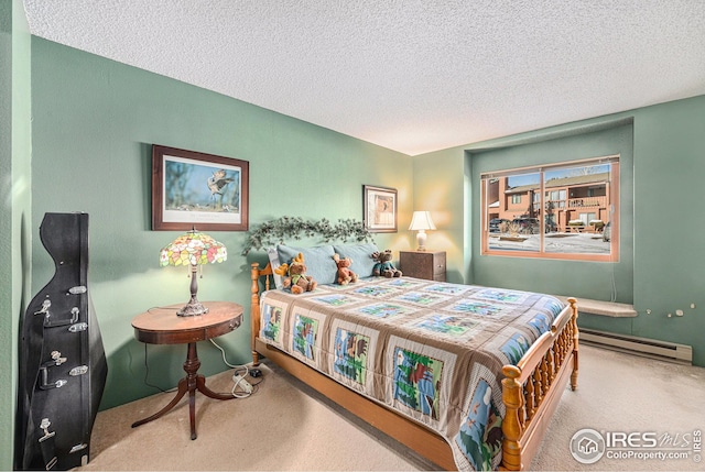 bedroom with carpet flooring, a baseboard radiator, and a textured ceiling