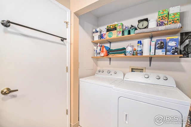 clothes washing area featuring washer and clothes dryer