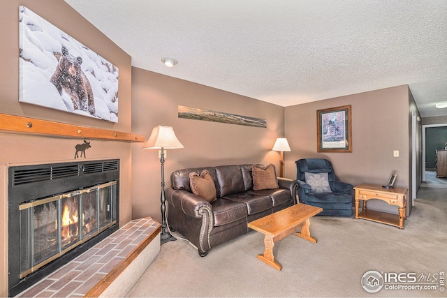 carpeted living room featuring a textured ceiling