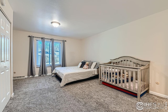 carpeted bedroom featuring a closet