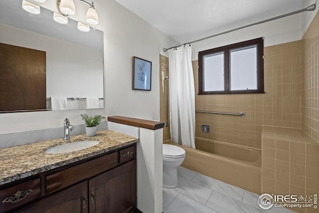 full bathroom featuring toilet, vanity, and shower / tub combo