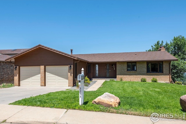 ranch-style home featuring a garage and a front yard