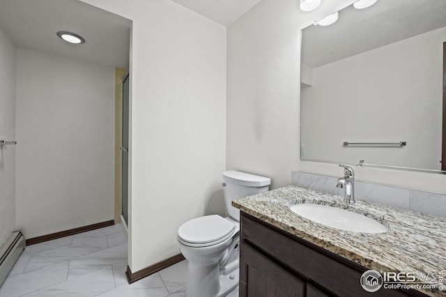 bathroom featuring vanity, toilet, baseboard heating, and a shower with door