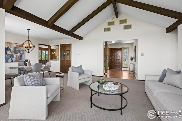 living room with high vaulted ceiling, light colored carpet, beamed ceiling, and a chandelier