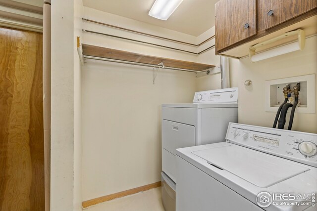 laundry area with cabinets and independent washer and dryer