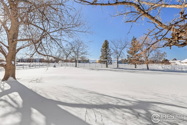 view of yard layered in snow