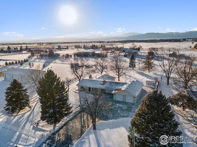 drone / aerial view featuring a mountain view