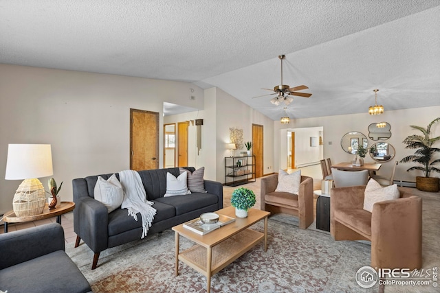 living room with ceiling fan, a textured ceiling, a baseboard heating unit, and lofted ceiling