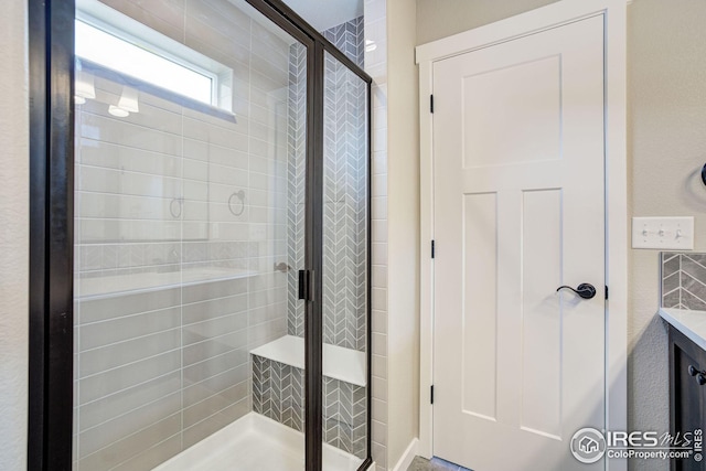 bathroom featuring a shower stall