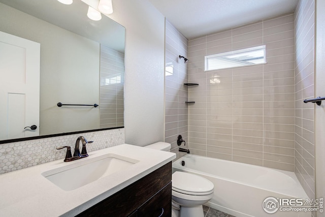 bathroom featuring tub / shower combination, toilet, and vanity