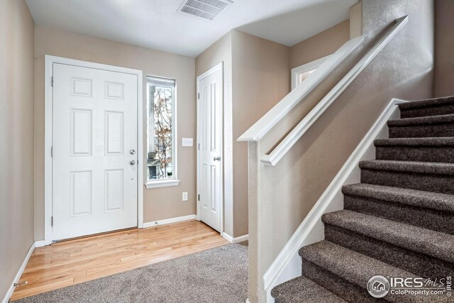 foyer featuring carpet floors