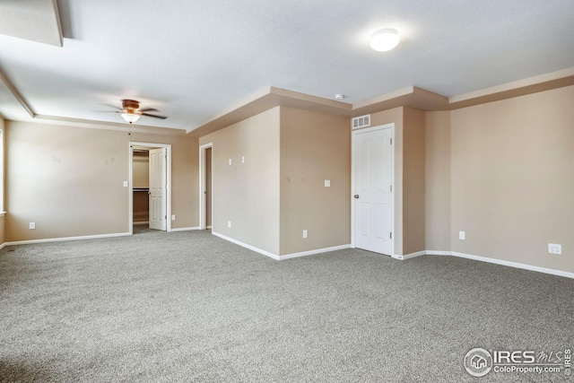 spare room featuring carpet floors and ceiling fan