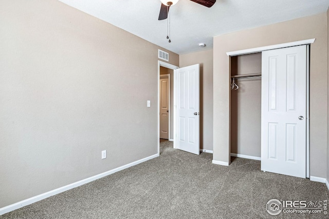 unfurnished bedroom featuring carpet flooring, ceiling fan, and a closet