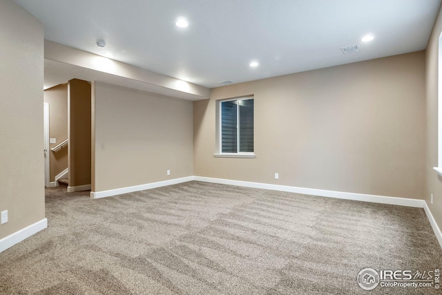 empty room with carpet flooring