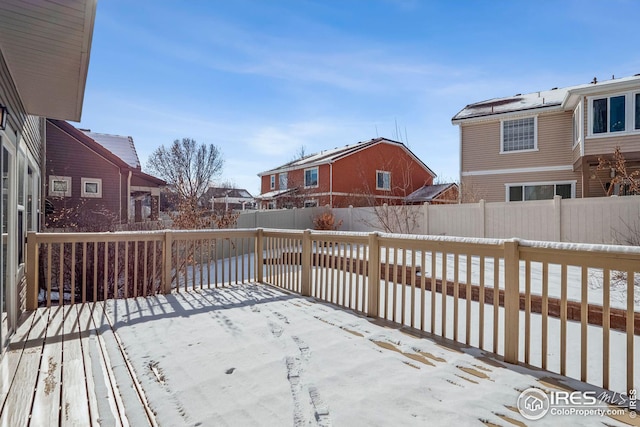 view of snow covered deck