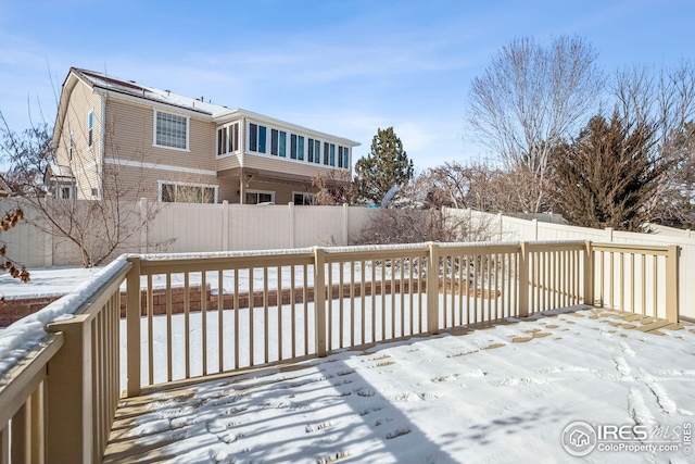 view of snow covered deck