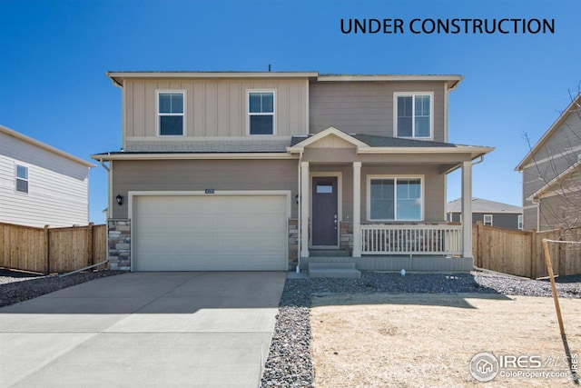 view of front of property with a garage and a porch