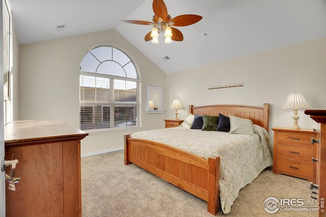 bedroom with light carpet, lofted ceiling, and ceiling fan