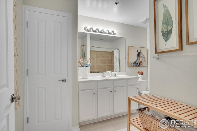 bathroom with vanity and a shower with shower curtain