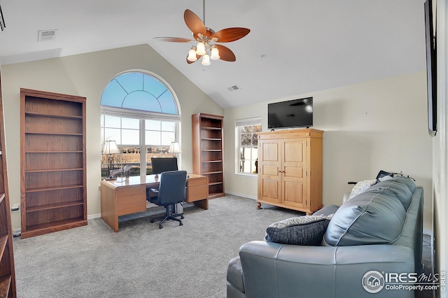 carpeted office featuring vaulted ceiling and ceiling fan