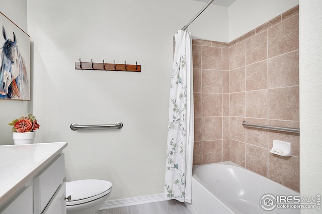 full bathroom with vanity, shower / tub combo, and toilet