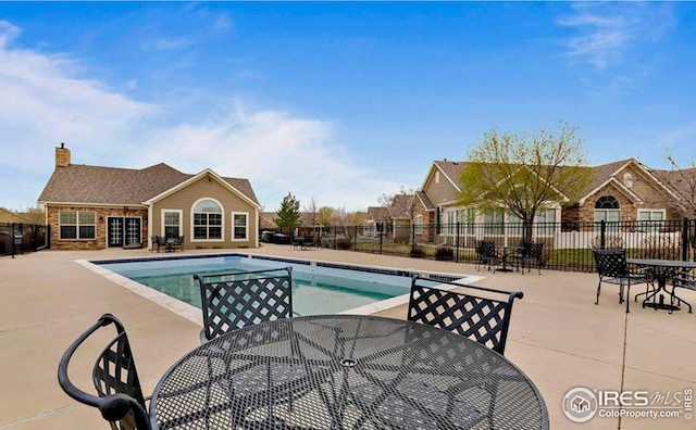 view of swimming pool with a patio area