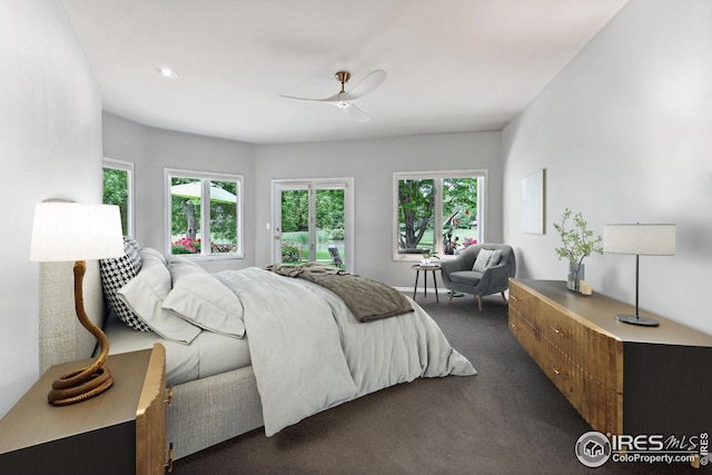 carpeted bedroom with multiple windows and ceiling fan