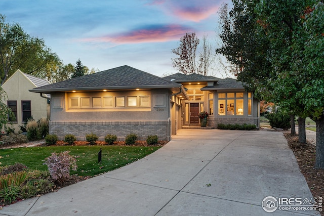 prairie-style house featuring a yard