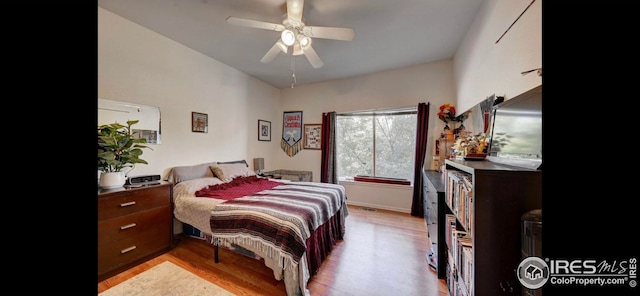 bedroom with ceiling fan and light hardwood / wood-style flooring