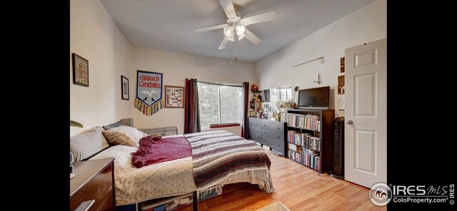 bedroom featuring light hardwood / wood-style flooring and ceiling fan