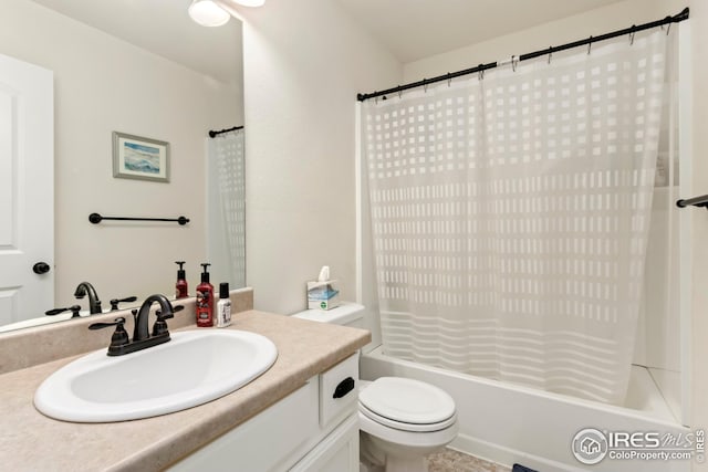 full bathroom with vanity, toilet, and shower / bath combo with shower curtain