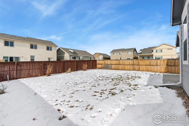 view of yard covered in snow