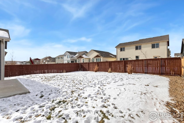 view of yard covered in snow