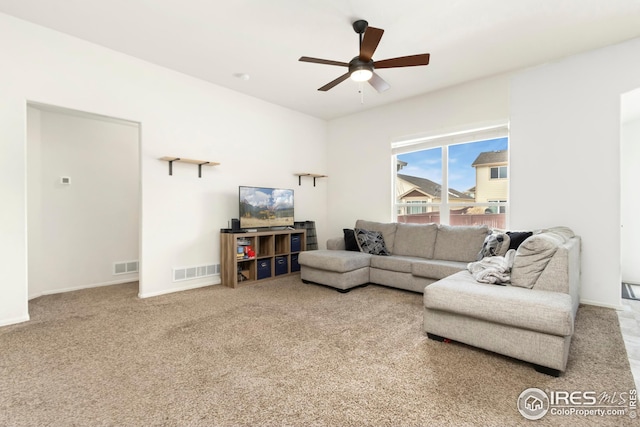 living room featuring carpet floors and ceiling fan