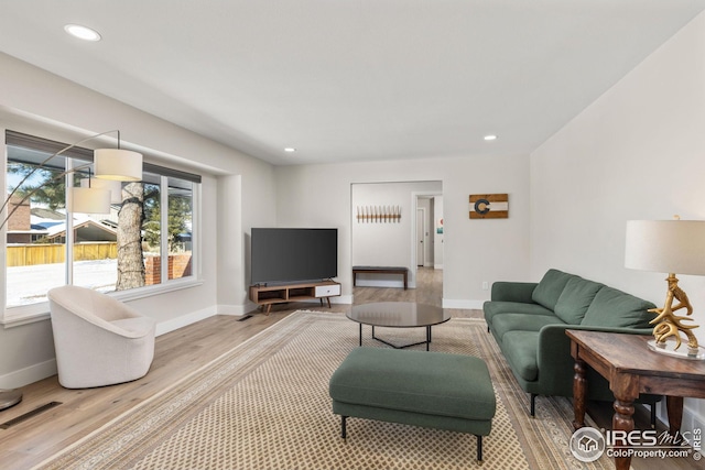 living room with light hardwood / wood-style floors