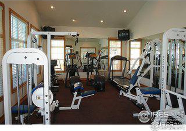 gym with lofted ceiling