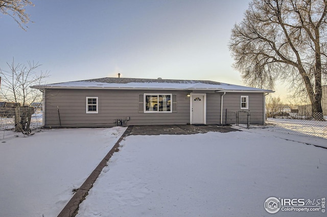 view of snow covered house