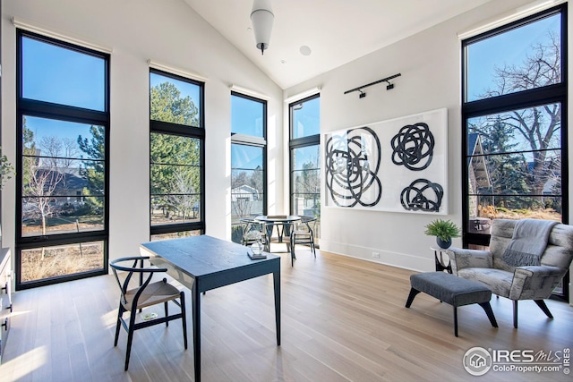3621 21st St, Boulder, CO 80304 - office space featuring light wood finished floors, high vaulted ceiling, and baseboards